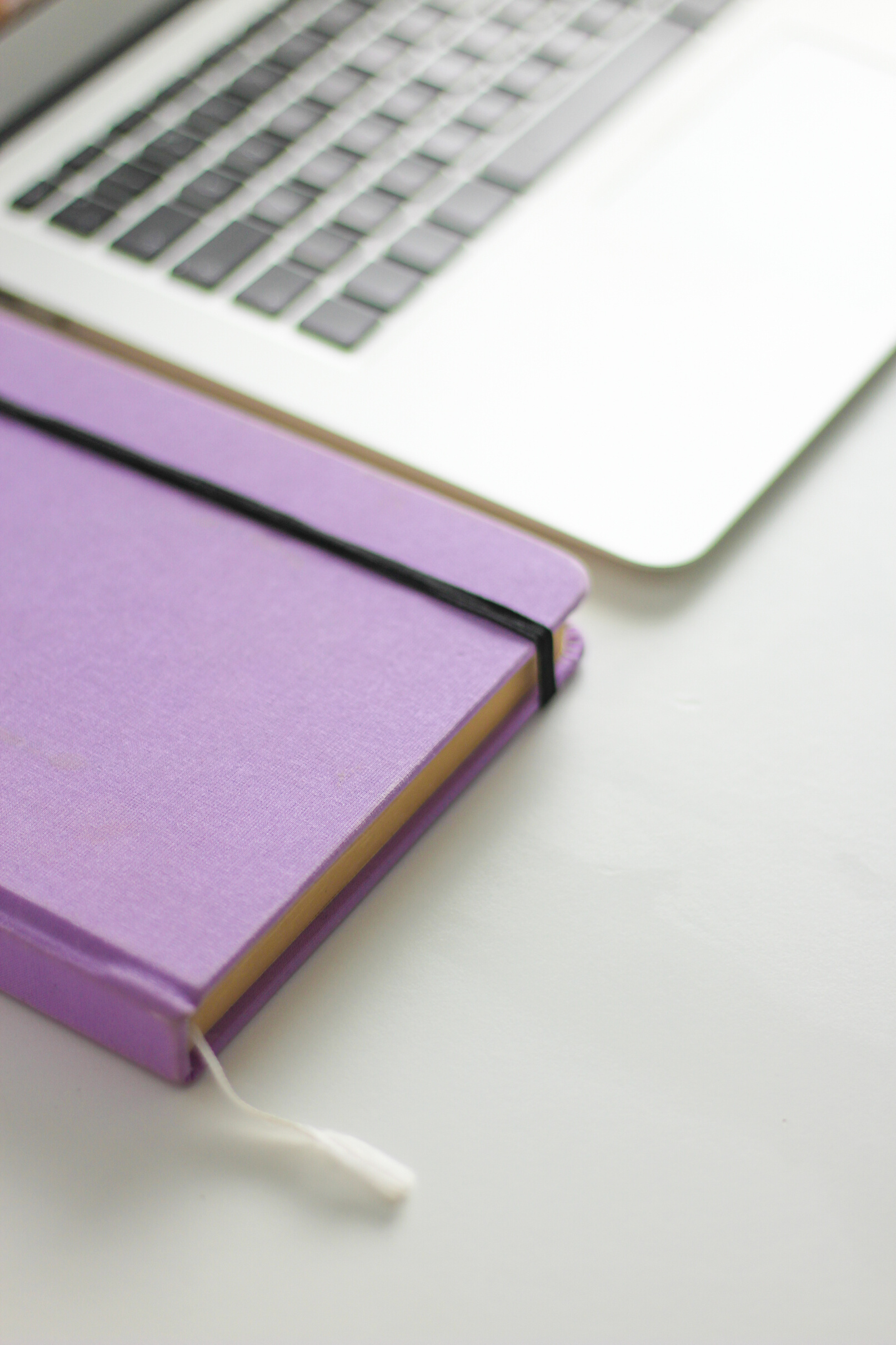 Purple notebook and computer